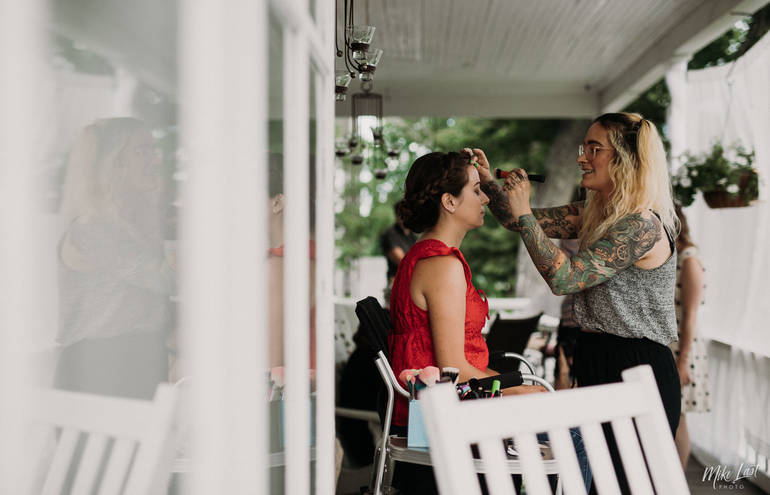 Makeup artist Elle Munster preparing bridesmaid for wedding